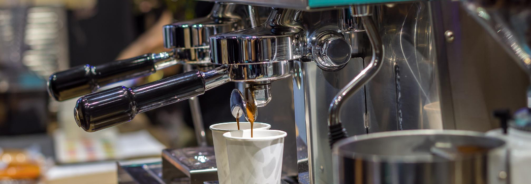 2 espressos being prepared in a coffee shop